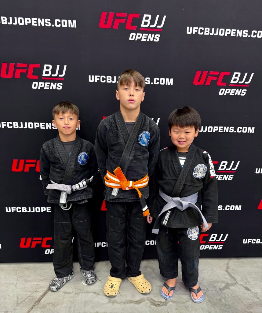 Mission Jiu Jitsu kids team in black gis at a BJJ tournament