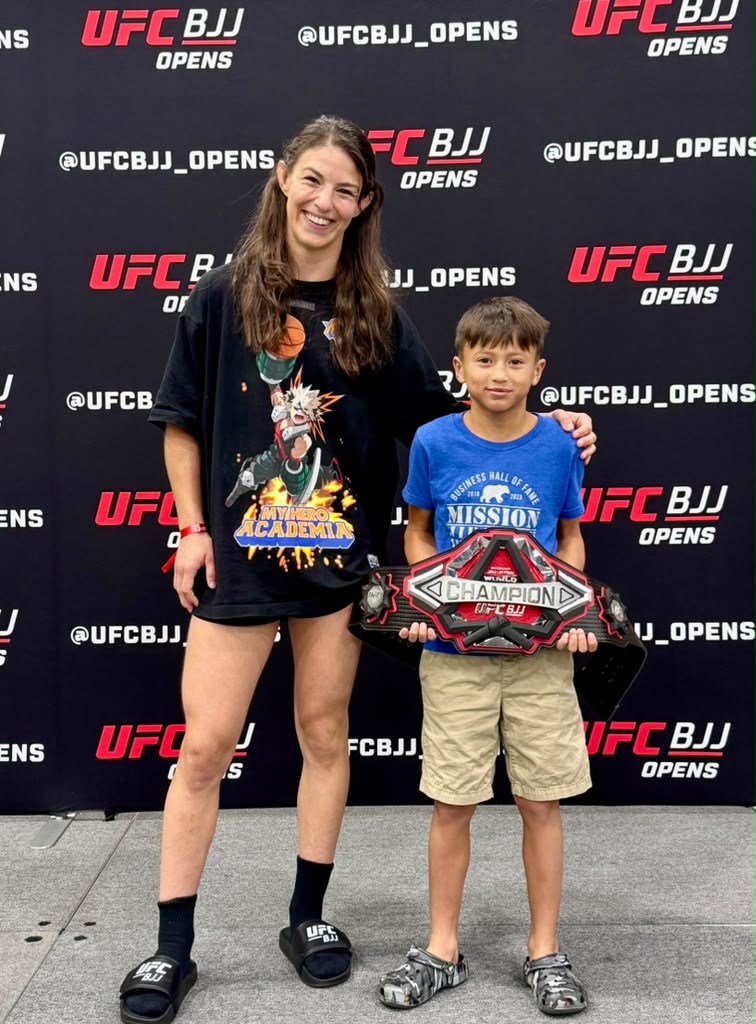 Young Mission Jiu Jitsu athlete with championship belt at UFC BJJ Opens