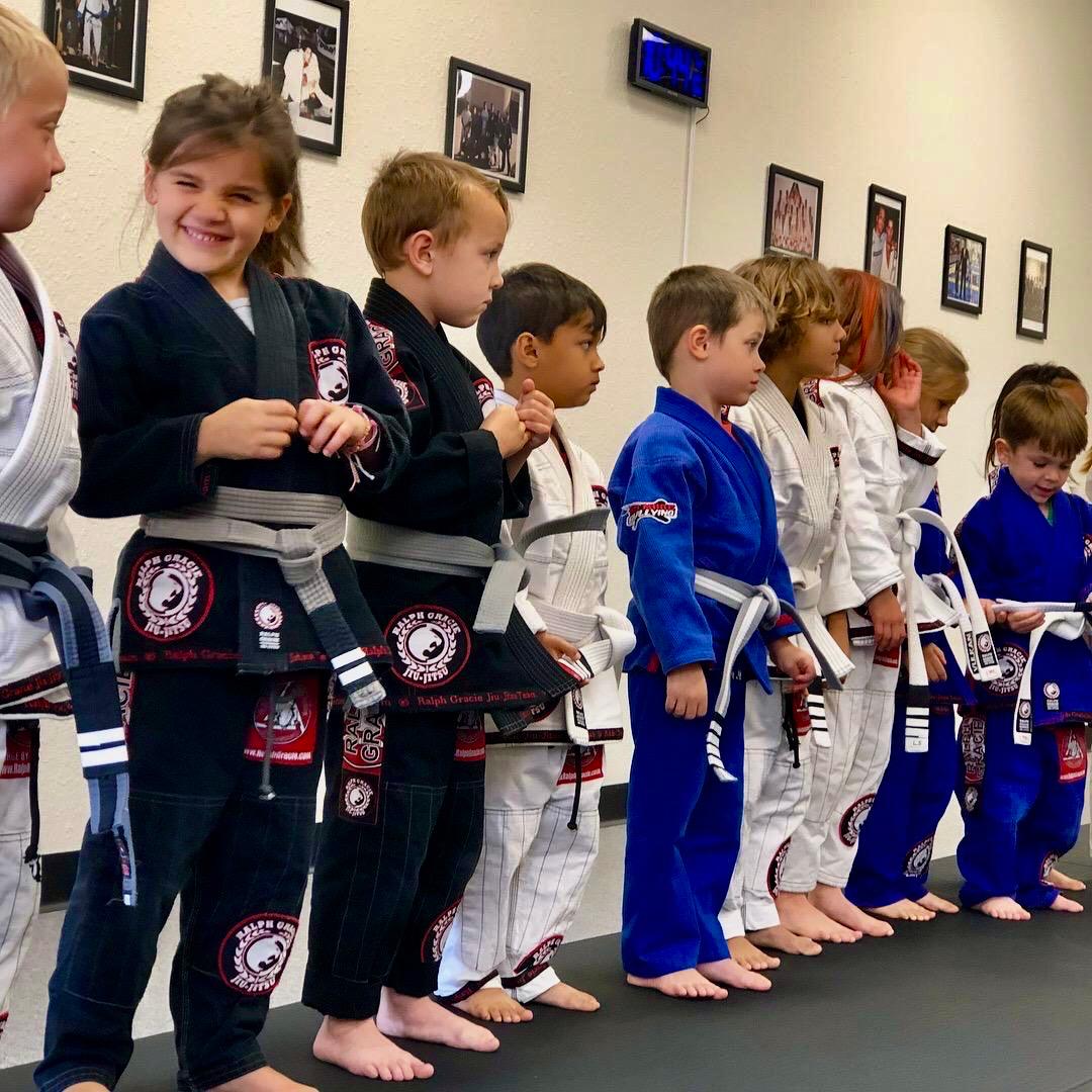 Mission Jiu Jitsu kids class lined up and smiling