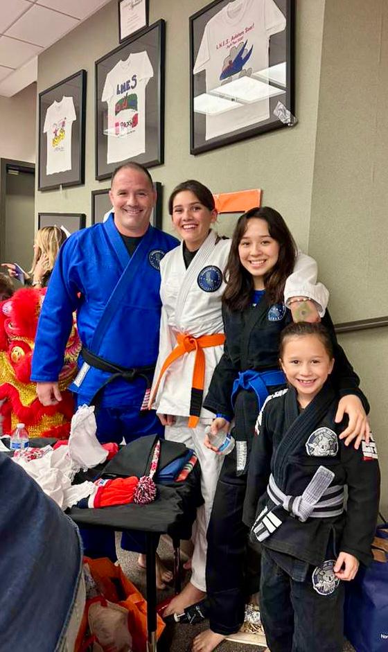 Professor Bob with students at a tournament