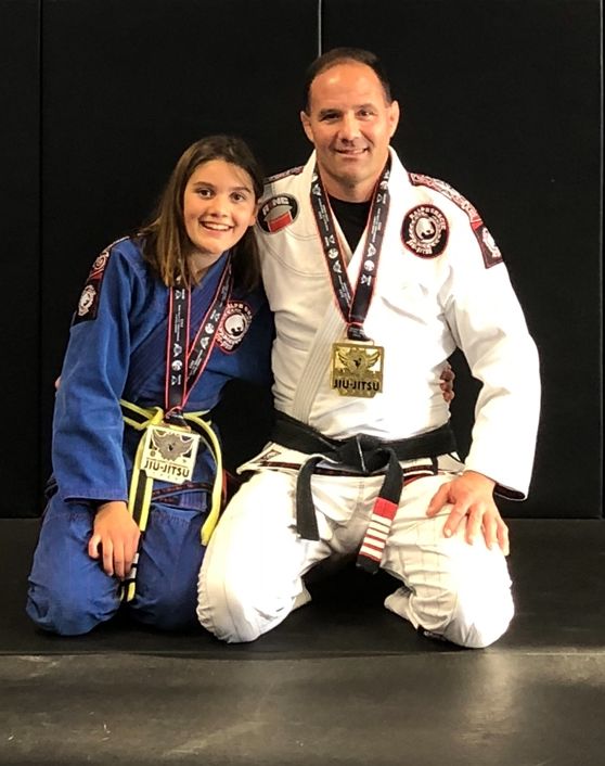 Professor Bob with student after gold medal win