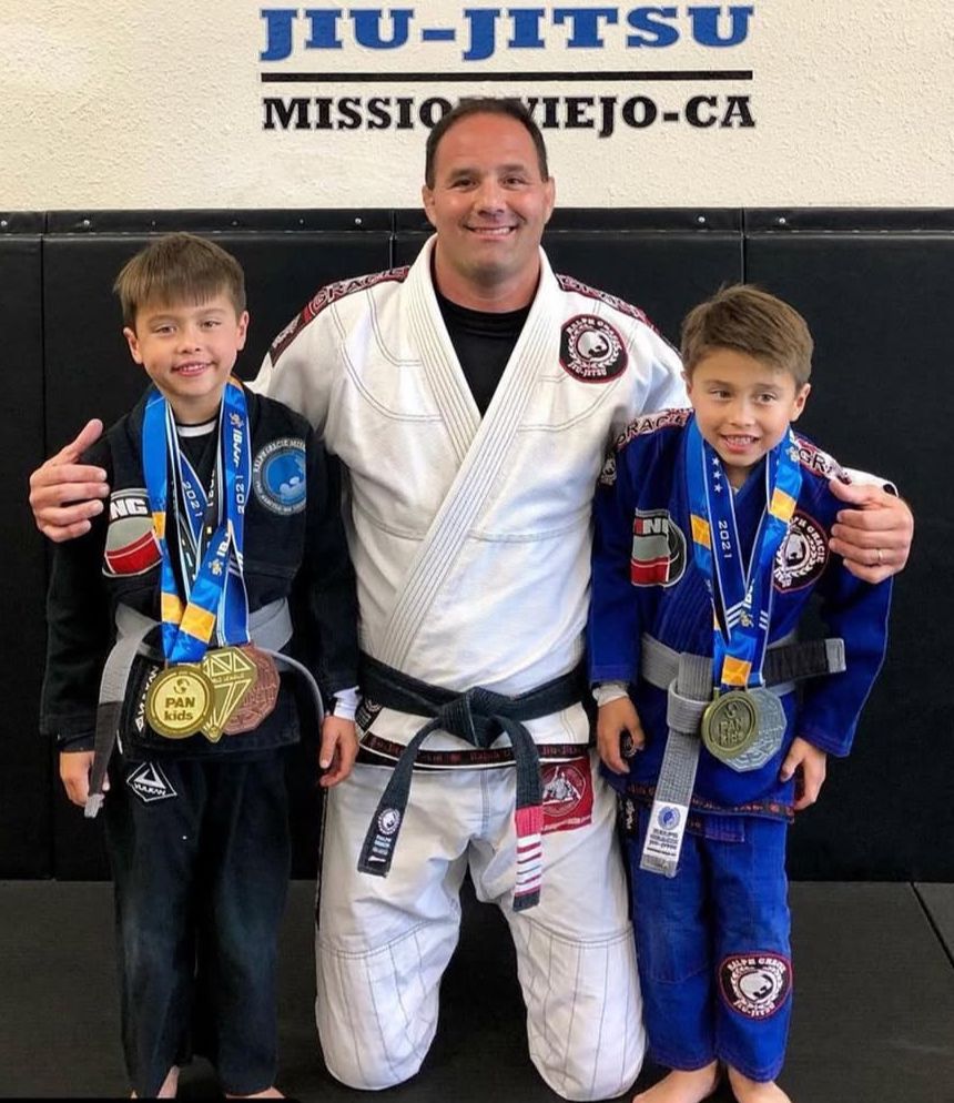 Professor Bob with PAN Kids medalists at the academy