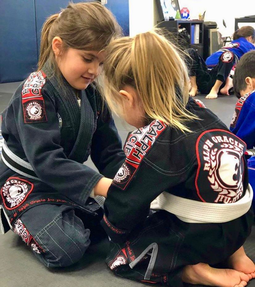 Young students bonding on the mats at Mission Jiu Jitsu Academy